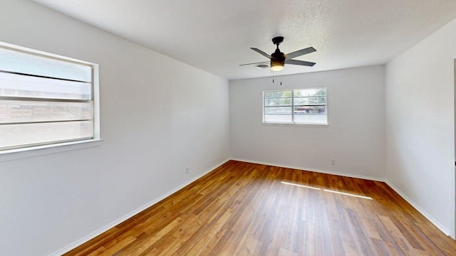 2013 S High St, Brady, TX 76825 - unfurnished room featuring wood finished floors, ceiling fan, and baseboards