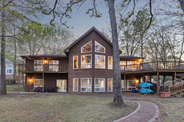 215 N Beverly Dr, Malakoff, TX 75148 - rear view of house featuring a wooden deck, french doors, a yard, and stairs
