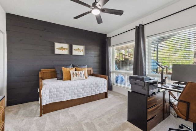 215 N Beverly Dr, Malakoff, TX 75148 - carpeted bedroom with an office area, wooden walls, and ceiling fan