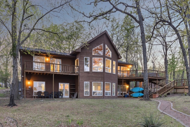 215 N Beverly Dr, Malakoff, TX 75148 - rear view of house with a wooden deck, a lawn, and stairway