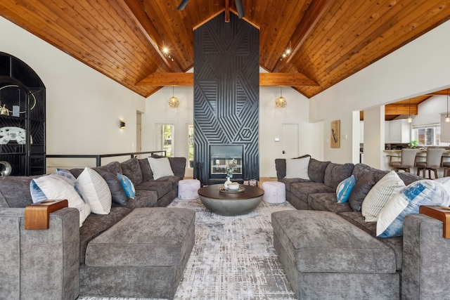 215 N Beverly Dr, Malakoff, TX 75148 - living room featuring high vaulted ceiling, a large fireplace, wooden ceiling with exposed beams, and healthy amount of natural light