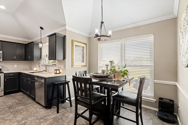 305 Margaret St, Fate, TX 75189 - kitchen featuring lofted ceiling, appliances with stainless steel finishes, tasteful backsplash, a chandelier, and a sink