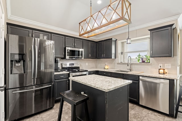 305 Margaret St, Fate, TX 75189 - kitchen featuring stainless steel appliances, ornamental molding, a sink, decorative backsplash, and a kitchen island