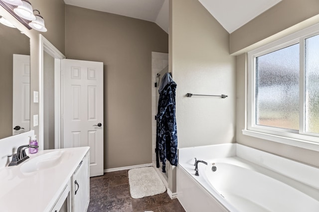 305 Margaret St, Fate, TX 75189 - full bathroom featuring a garden tub, vanity, a shower with curtain, lofted ceiling, and baseboards