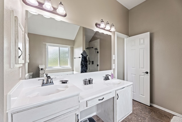 305 Margaret St, Fate, TX 75189 - bathroom featuring a shower stall, double vanity, and baseboards