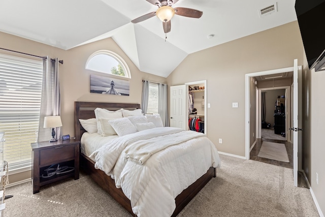 305 Margaret St, Fate, TX 75189 - bedroom featuring attic access, carpet floors, a walk in closet, lofted ceiling, and baseboards