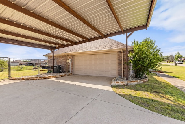 305 Margaret St, Fate, TX 75189 - view of patio with a garage, driveway, and a gate