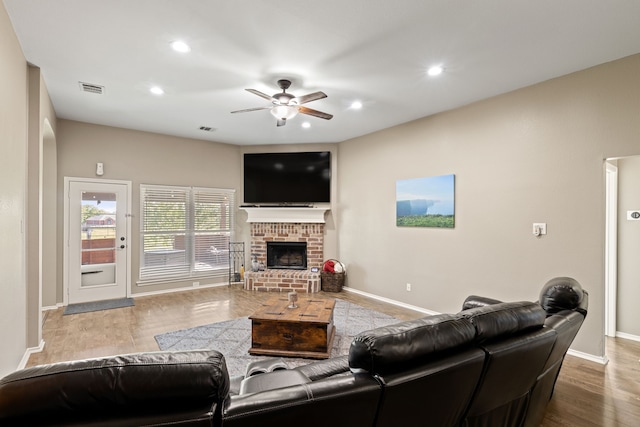 305 Margaret St, Fate, TX 75189 - living area with ceiling fan, baseboards, wood finished floors, a brick fireplace, and recessed lighting