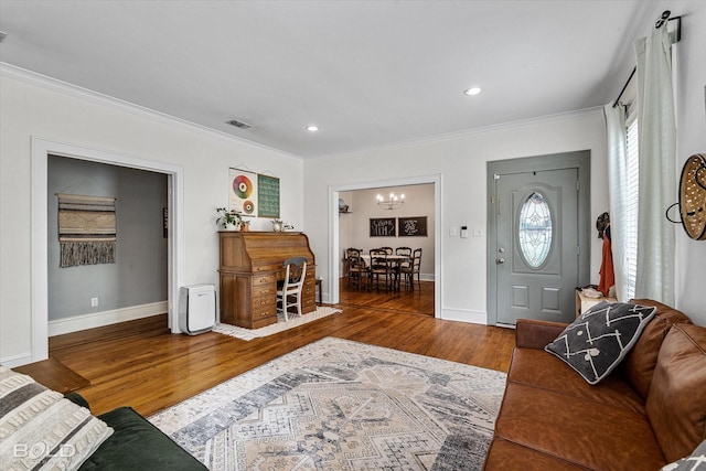 3526 Greenway Pl, Shreveport, LA 71105 - entryway with ornamental molding, wood finished floors, a chandelier, baseboards, and recessed lighting