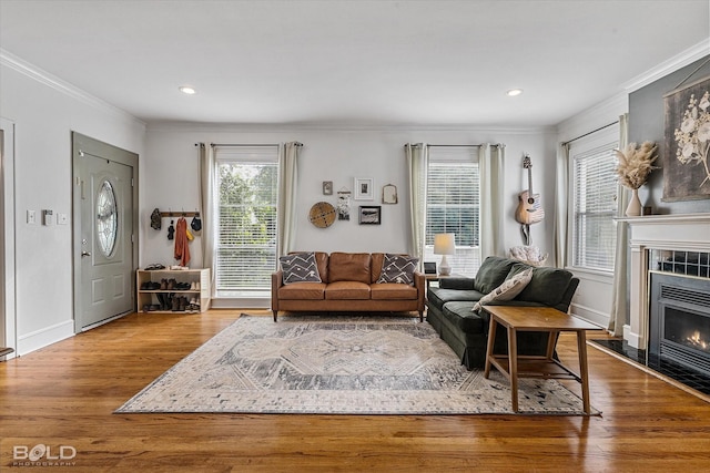 3526 Greenway Pl, Shreveport, LA 71105 - living area with crown molding, healthy amount of natural light, wood finished floors, a fireplace, and baseboards