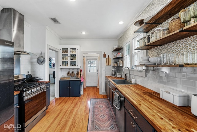 3526 Greenway Pl, Shreveport, LA 71105 - kitchen featuring wooden counters, stainless steel appliances, a sink, open shelves, and tasteful backsplash