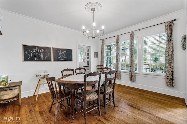 3526 Greenway Pl, Shreveport, LA 71105 - dining space with baseboards, a chandelier, crown molding, and wood finished floors