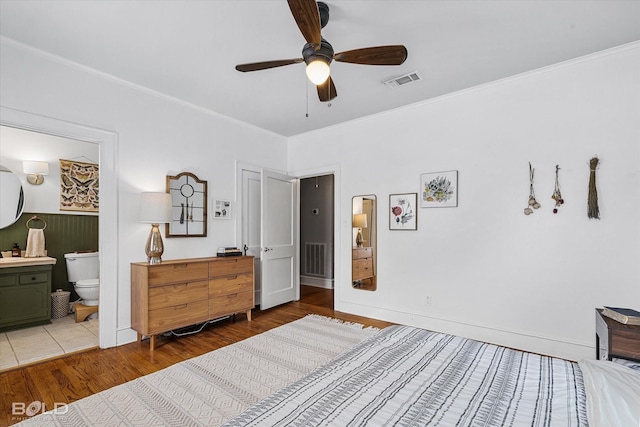 3526 Greenway Pl, Shreveport, LA 71105 - bedroom featuring wood finished floors, ornamental molding, ensuite bath, baseboards, and a ceiling fan