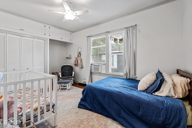 3526 Greenway Pl, Shreveport, LA 71105 - bedroom with cooling unit, a ceiling fan, a closet, and light wood-type flooring