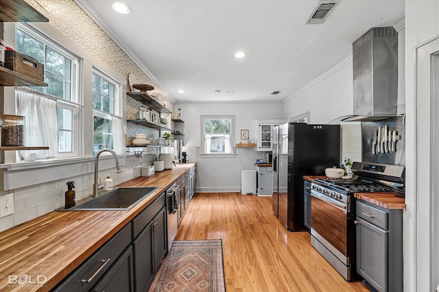 3526 Greenway Pl, Shreveport, LA 71105 - kitchen featuring wood counters, stainless steel gas range, a sink, ornamental molding, and open shelves