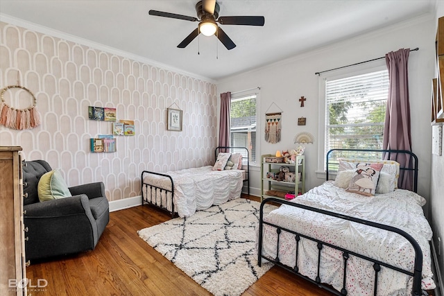 3526 Greenway Pl, Shreveport, LA 71105 - bedroom featuring wood finished floors, ornamental molding, baseboards, wallpapered walls, and ceiling fan