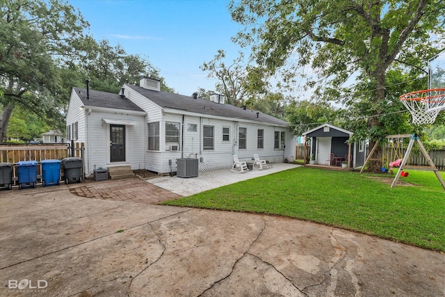 3526 Greenway Pl, Shreveport, LA 71105 - rear view of property with a patio area, entry steps, an outbuilding, roof with shingles, and a playground