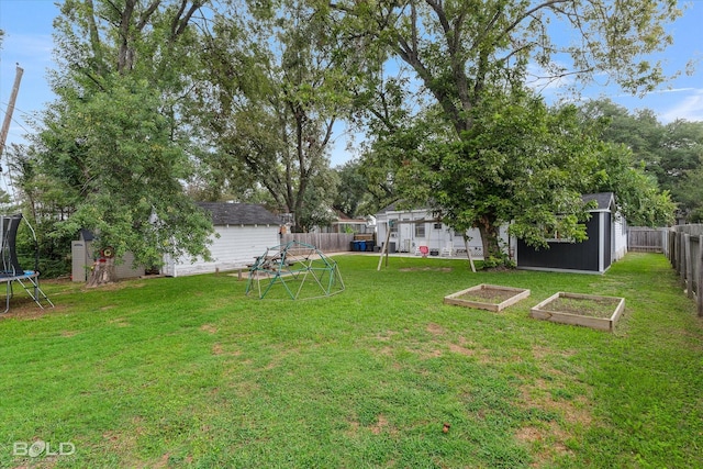 3526 Greenway Pl, Shreveport, LA 71105 - view of yard with a trampoline and a vegetable garden