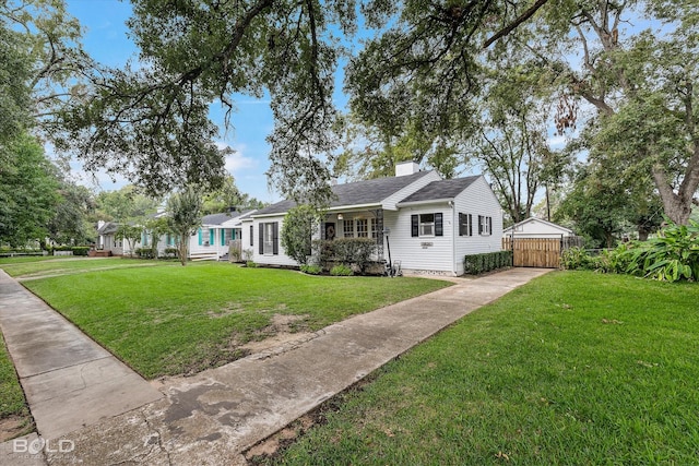 3526 Greenway Pl, Shreveport, LA 71105 - view of front of house featuring driveway, a chimney, and roof with shingles