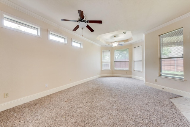 2917 Cascade Dr, Plano, TX 75025 - spare room with ornamental molding, a ceiling fan, light carpet, a raised ceiling, and plenty of natural light