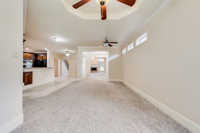 2917 Cascade Dr, Plano, TX 75025 - unfurnished living room with a ceiling fan, light carpet, a raised ceiling, ornamental molding, and baseboards