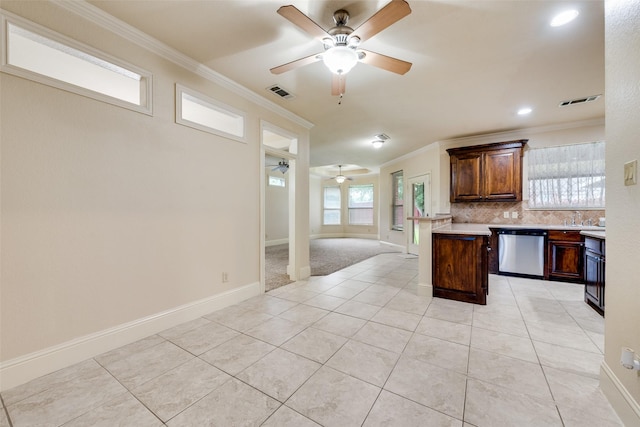 2917 Cascade Dr, Plano, TX 75025 - kitchen with stainless steel dishwasher, ceiling fan, open floor plan, crown molding, and light countertops