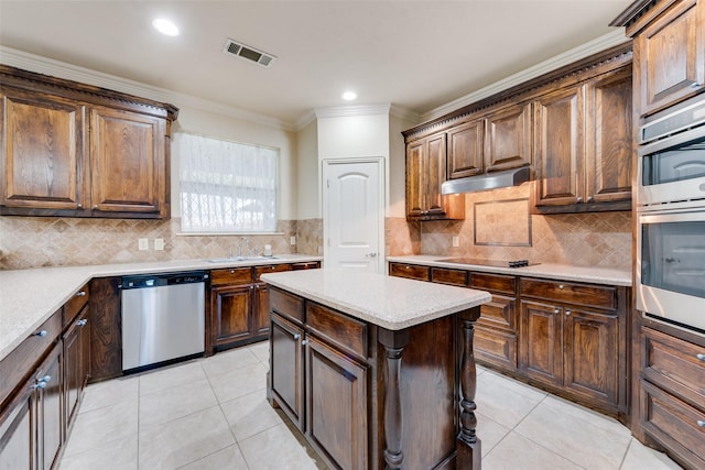 2917 Cascade Dr, Plano, TX 75025 - kitchen featuring stainless steel appliances, under cabinet range hood, ornamental molding, light tile patterned floors, and backsplash