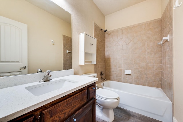 2917 Cascade Dr, Plano, TX 75025 - full bathroom featuring toilet, vanity, wood finished floors, and shower / bathtub combination