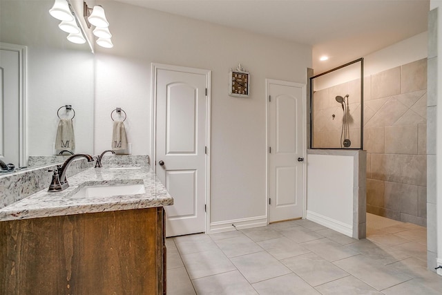 128 Colonial Dr, Joshua, TX 76058 - full bath with tile patterned floors, double vanity, a walk in shower, and a chandelier