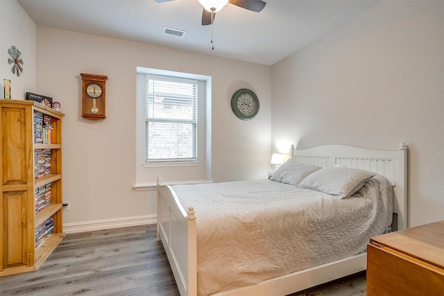 128 Colonial Dr, Joshua, TX 76058 - bedroom featuring wood finished floors, baseboards, and ceiling fan