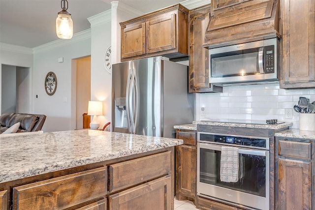 128 Colonial Dr, Joshua, TX 76058 - kitchen featuring stainless steel appliances, ornamental molding, decorative backsplash, light stone countertops, and hanging light fixtures