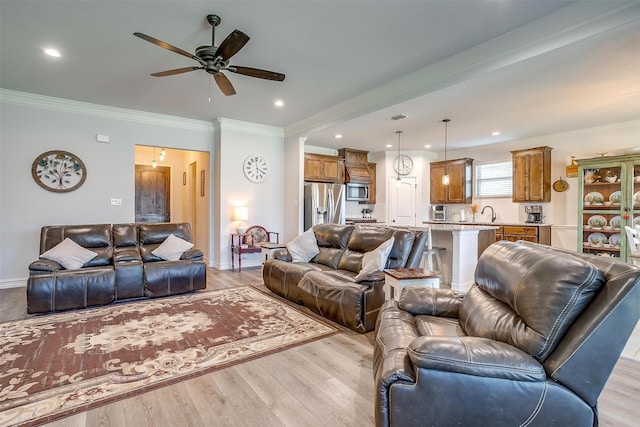 128 Colonial Dr, Joshua, TX 76058 - living area with light wood finished floors, ceiling fan, crown molding, recessed lighting, and baseboards