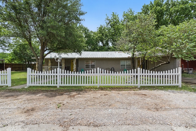 210 Aikens St, Lipan, TX 76462 - single story home featuring a fenced front yard and metal roof