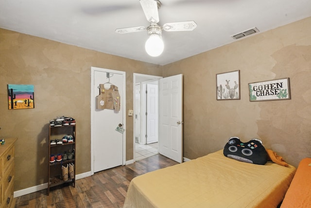 210 Aikens St, Lipan, TX 76462 - bedroom with dark wood-type flooring, a ceiling fan, and baseboards