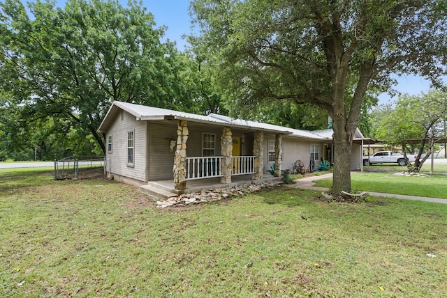 210 Aikens St, Lipan, TX 76462 - view of front of home with covered porch, a front yard, and metal roof
