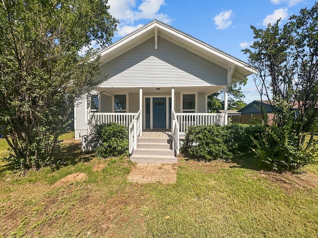 102 Bois D Arc St, Whitesboro, TX 76273 - view of front of home with covered porch and a front yard