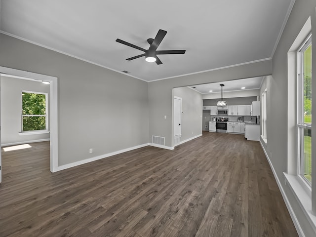 102 Bois D Arc St, Whitesboro, TX 76273 - unfurnished living room featuring crown molding, healthy amount of natural light, dark wood-style floors, baseboards, and a ceiling fan
