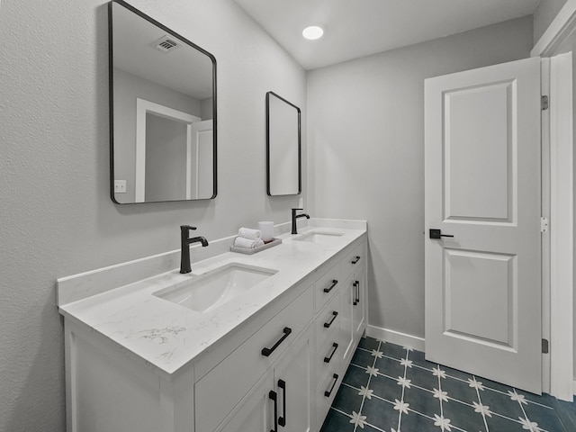 102 Bois D Arc St, Whitesboro, TX 76273 - full bathroom featuring double vanity, tile patterned floors, and baseboards