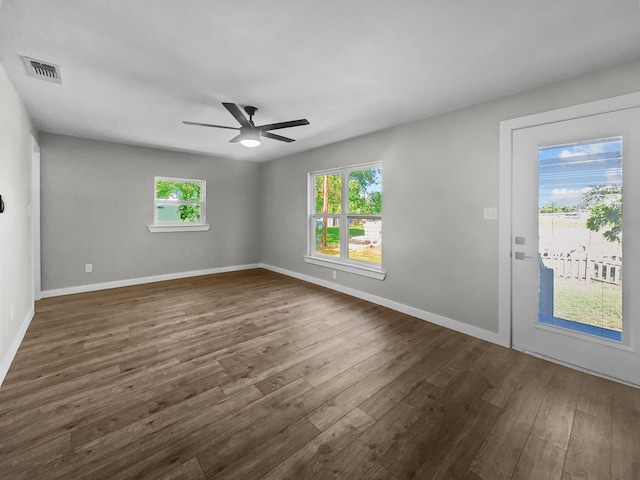 102 Bois D Arc St, Whitesboro, TX 76273 - spare room featuring healthy amount of natural light, dark wood-style flooring, ceiling fan, and baseboards