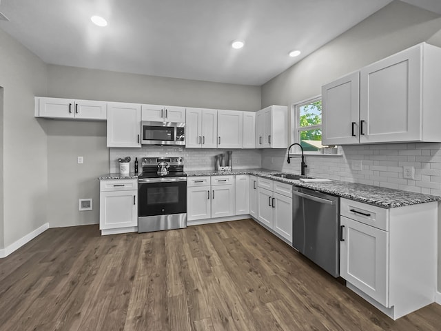 102 Bois D Arc St, Whitesboro, TX 76273 - kitchen featuring stainless steel appliances, a sink, light stone countertops, white cabinets, and recessed lighting
