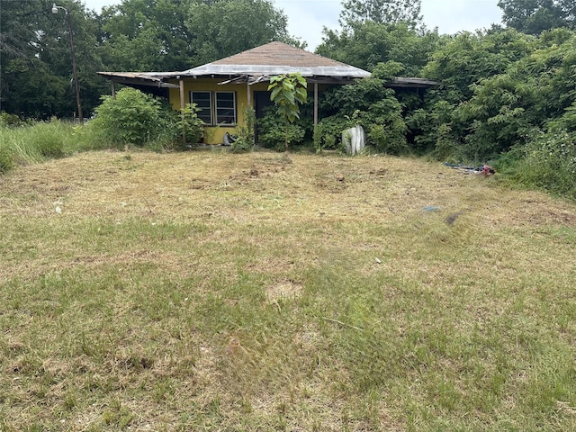 204 N 6th St, Talco, TX 75487 - view of yard with a view of trees