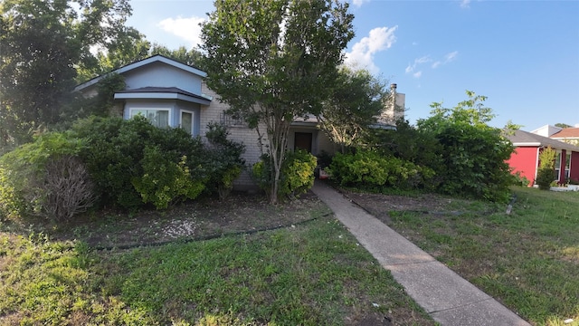 1817 Lewis Dr, Garland, TX 75041 - obstructed view of property featuring a front yard