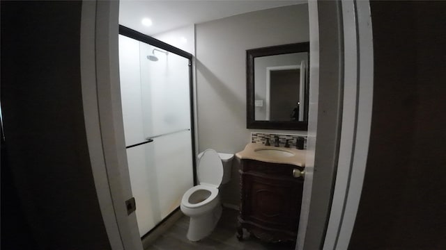 1817 Lewis Dr, Garland, TX 75041 - full bathroom featuring a shower stall, vanity, and toilet