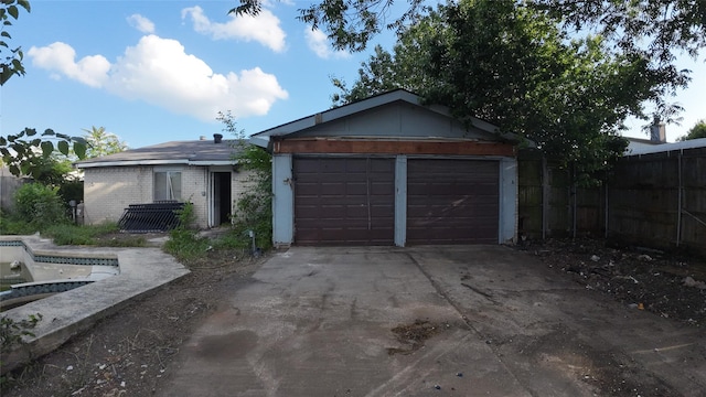 1817 Lewis Dr, Garland, TX 75041 - ranch-style home with driveway, an attached garage, and brick siding