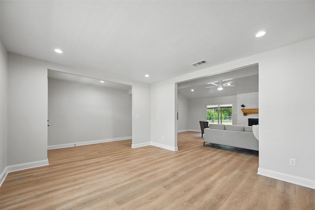 342 Willow Wood St, Murphy, TX 75094 - unfurnished living room with light wood finished floors, recessed lighting, baseboards, a large fireplace, and a ceiling fan