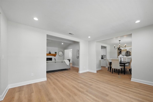 342 Willow Wood St, Murphy, TX 75094 - living room featuring light wood finished floors, a fireplace, a chandelier, recessed lighting, and baseboards