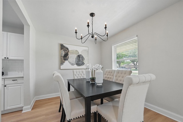 342 Willow Wood St, Murphy, TX 75094 - dining area with a chandelier, baseboards, and light wood-style flooring