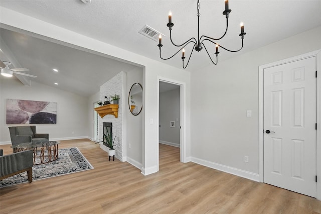 342 Willow Wood St, Murphy, TX 75094 - living room with a chandelier, light wood finished floors, a ceiling fan, and baseboards