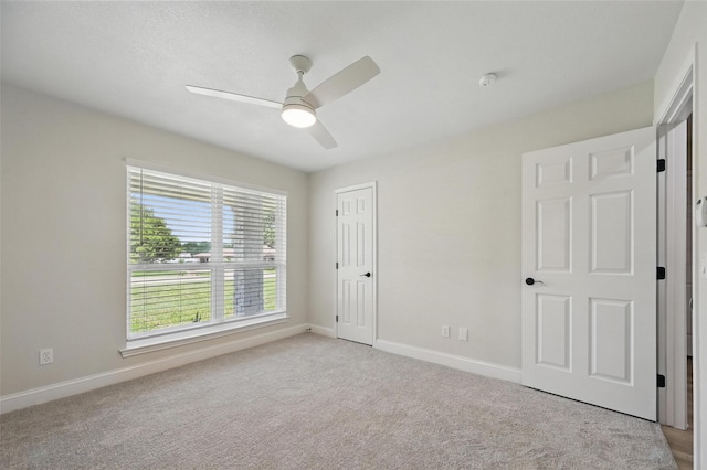 342 Willow Wood St, Murphy, TX 75094 - unfurnished bedroom featuring light carpet, baseboards, and ceiling fan