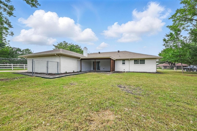 342 Willow Wood St, Murphy, TX 75094 - rear view of house with brick siding and a chimney